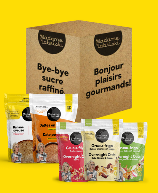 Cette boîte déjeuner sans sucre comprend 9 produits santé sans sucre raffiné Madame Labriski, dont les gruaux 3 x moins de sucre, le mélange à pain aux bananes et les dattes en poudre.